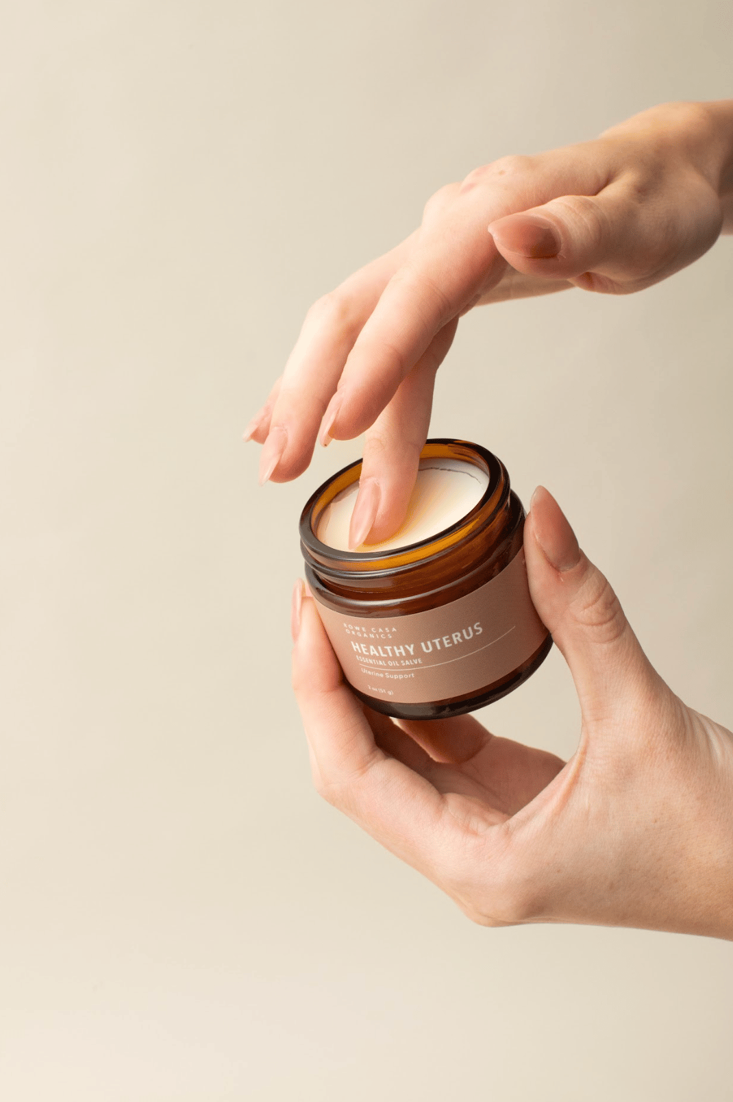 Person sitting on floor working on laptop